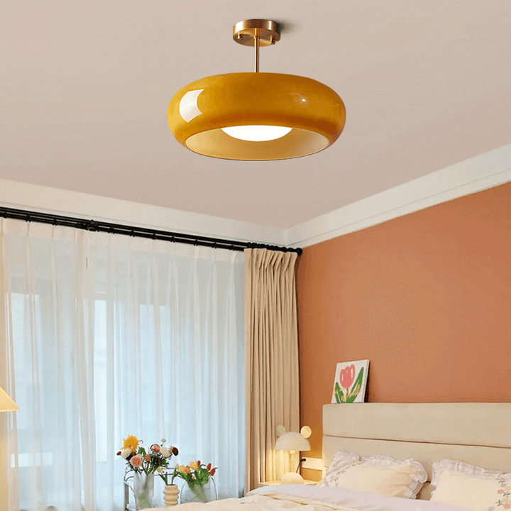 Vintage loftslampe med orange glaskuppel og kobberstel