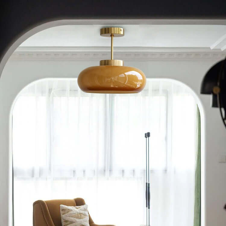 Vintage loftslampe med orange glaskuppel og kobberstel