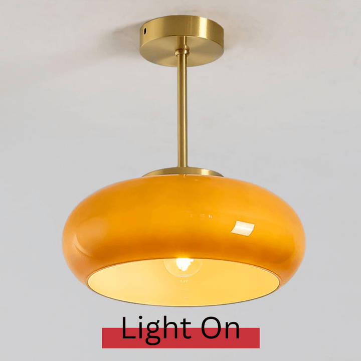 Vintage loftslampe med orange glaskuppel og kobberstel