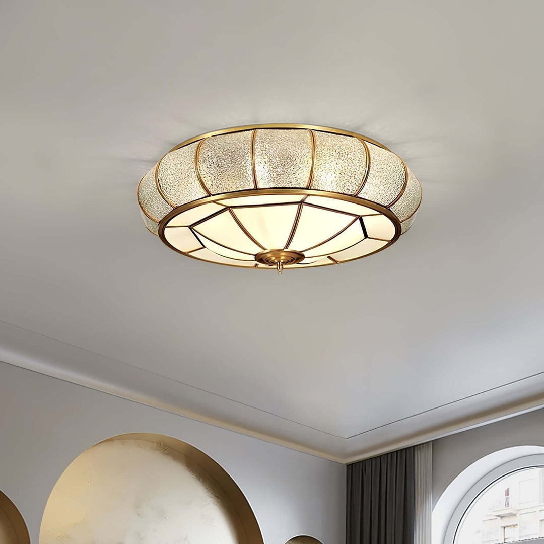 Moderne guldbelagt pendellampe med tekstureret glas