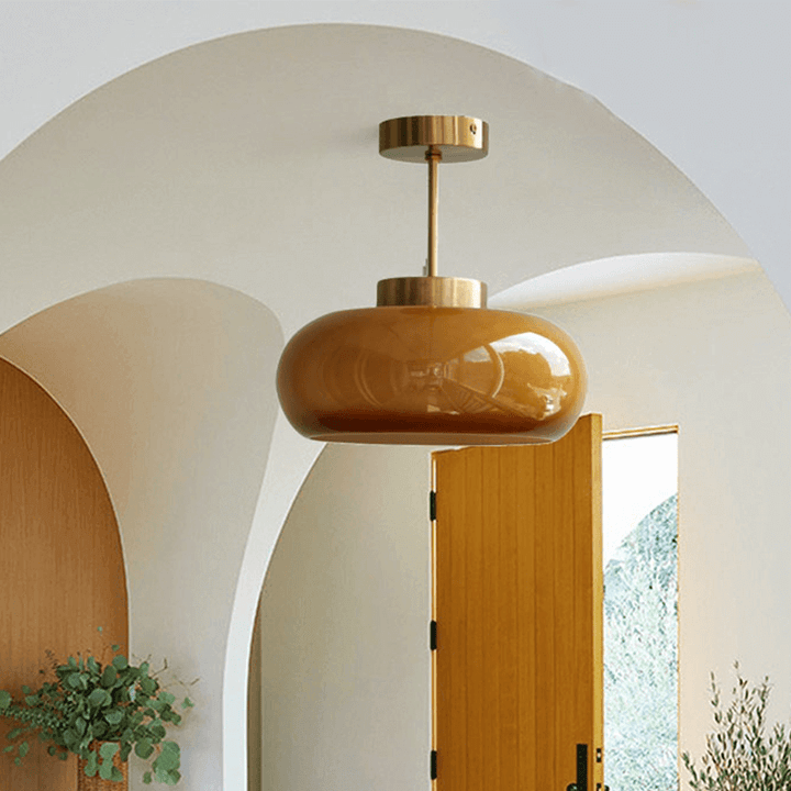 Vintage loftslampe med orange glaskuppel og kobberstel