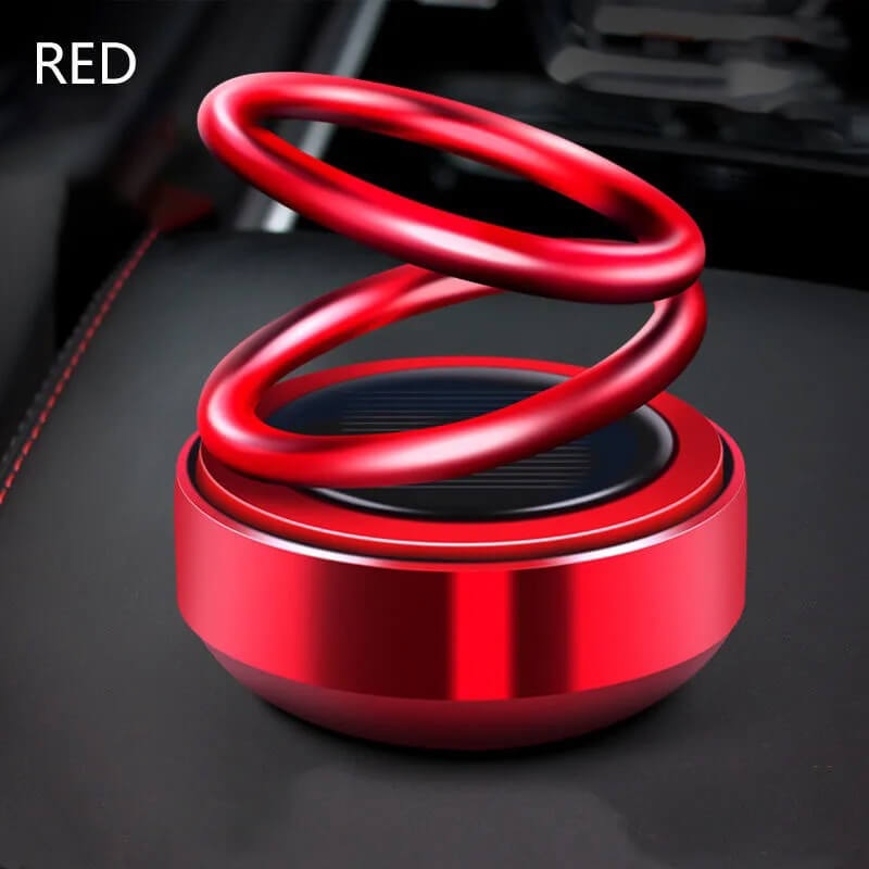 Aurinkoenergialla toimiva kaksoisrenkainen aromaterapiakoriste autoon, punainen metallinen design, raikas tuoksu.