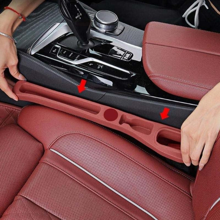 "Auton istuimen välin täyte, musta, estää esineiden putoamisen, lisäten säilytystilaa autossa. Käytännöllinen ja vuotamaton."