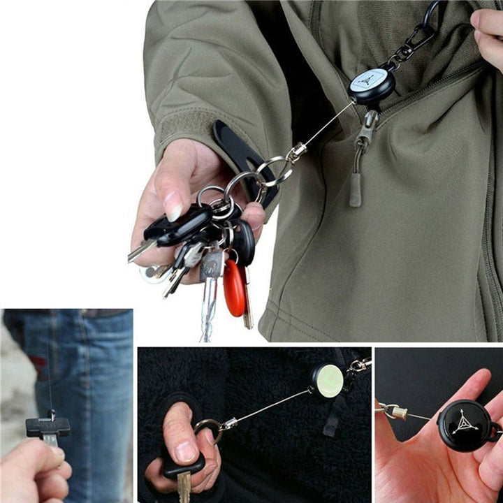 Nøglering med sort design og metallisk udtrækkeligt kabel, et praktisk og holdbart tilbehør.