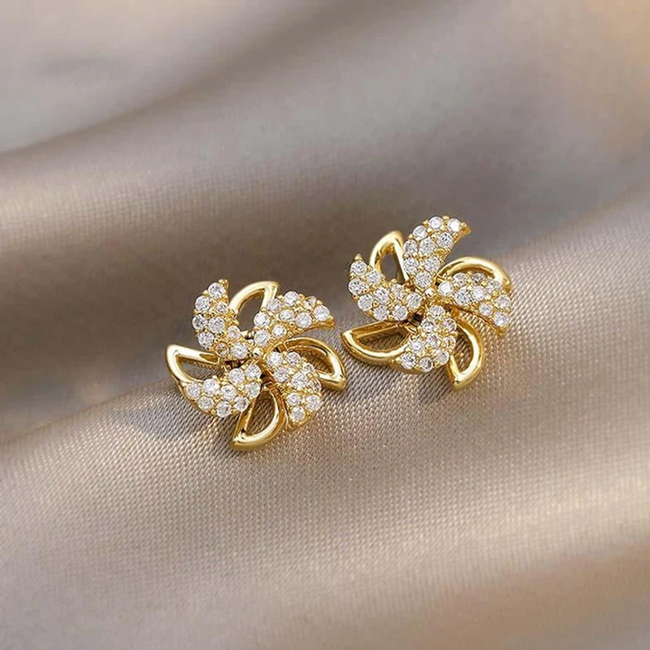 Dame elegante roterbare vindmølle øreringe, 18K guld, glitrende i lyset for at fremhæve kvinders stil og glæde.