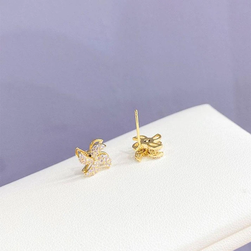 Dame elegante roterbare vindmølle øreringe, 18K guld, glitrende i lyset for at fremhæve kvinders stil og glæde.