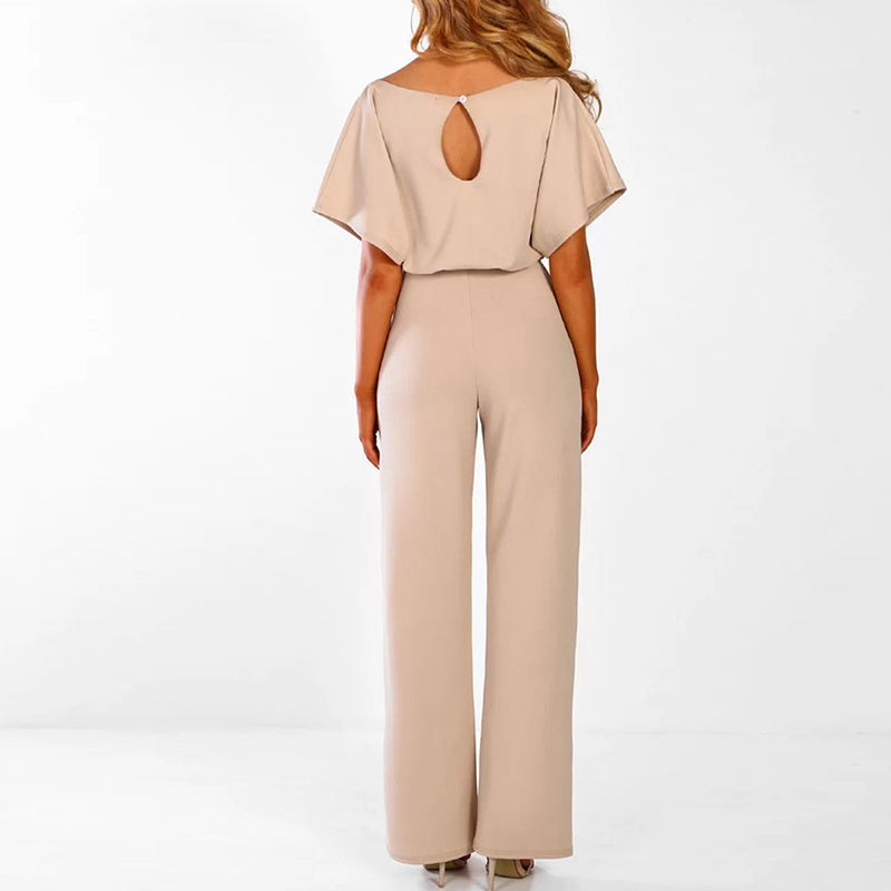 Elegant dame jumpsuit i beige med blonde detaljer, vide ben, perfekt til fester og hverdag.