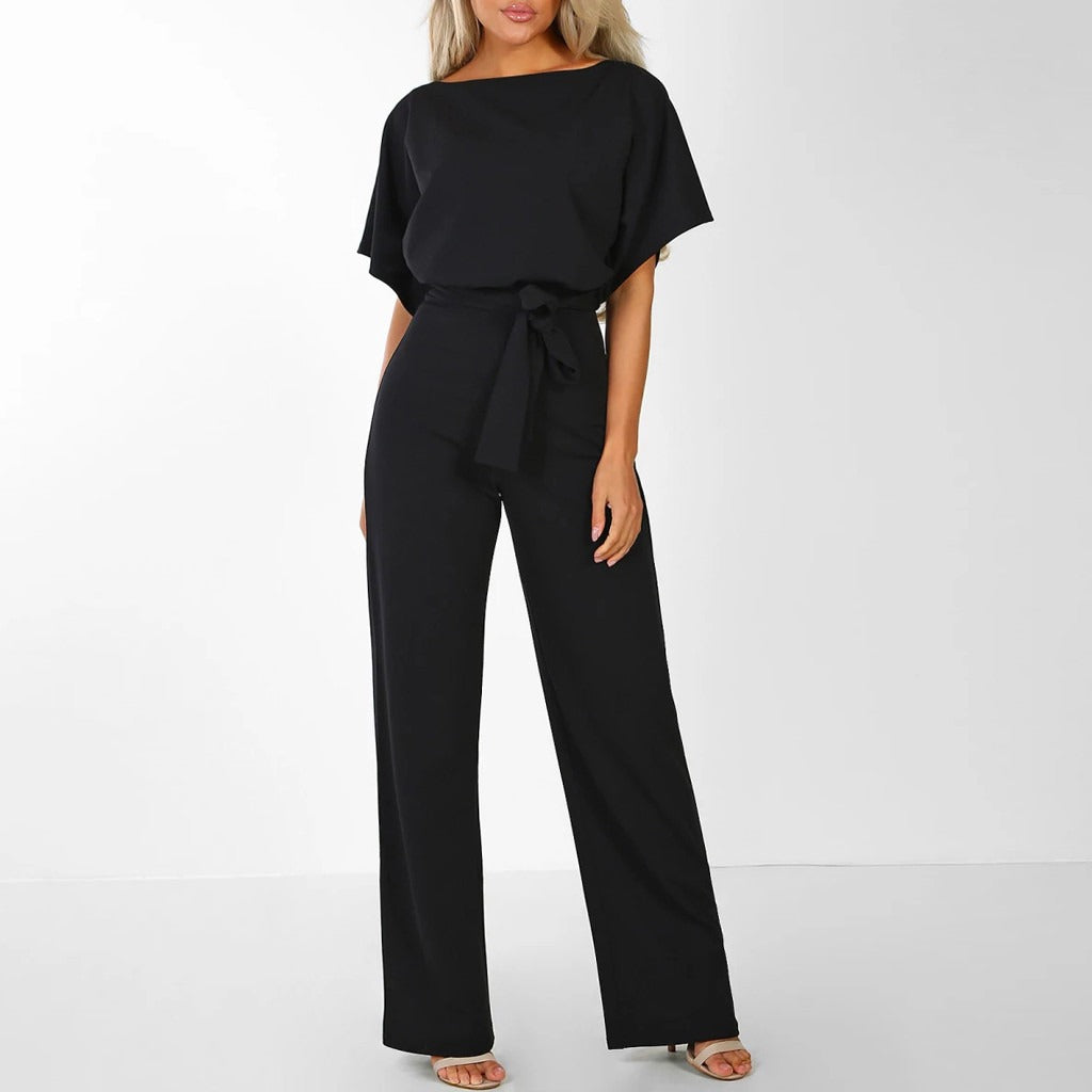 Elegant dame jumpsuit i beige med blonde detaljer, vide ben, perfekt til fester og hverdag.