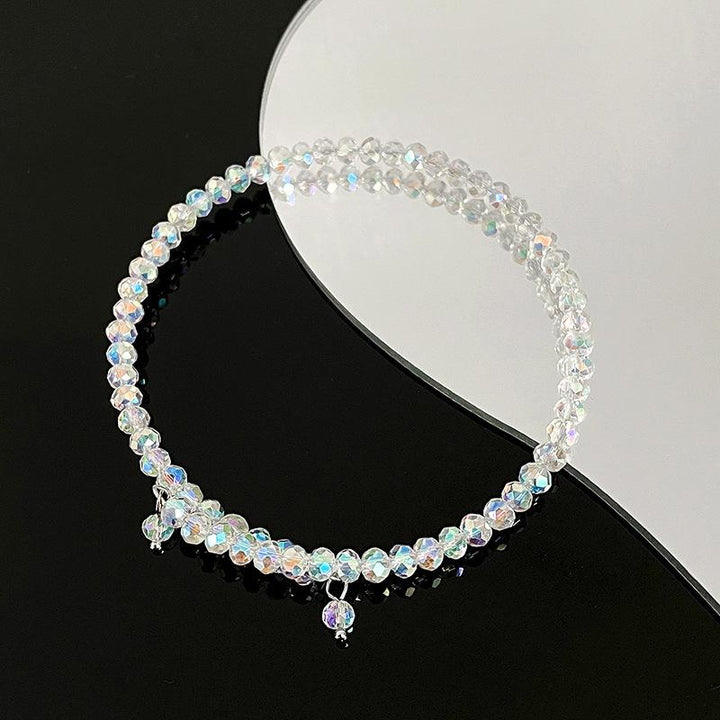 Elegant damearmbånd med krystalperler og krystalludsmykning, funklende og justerbart tilbehør til fester og hverdag.