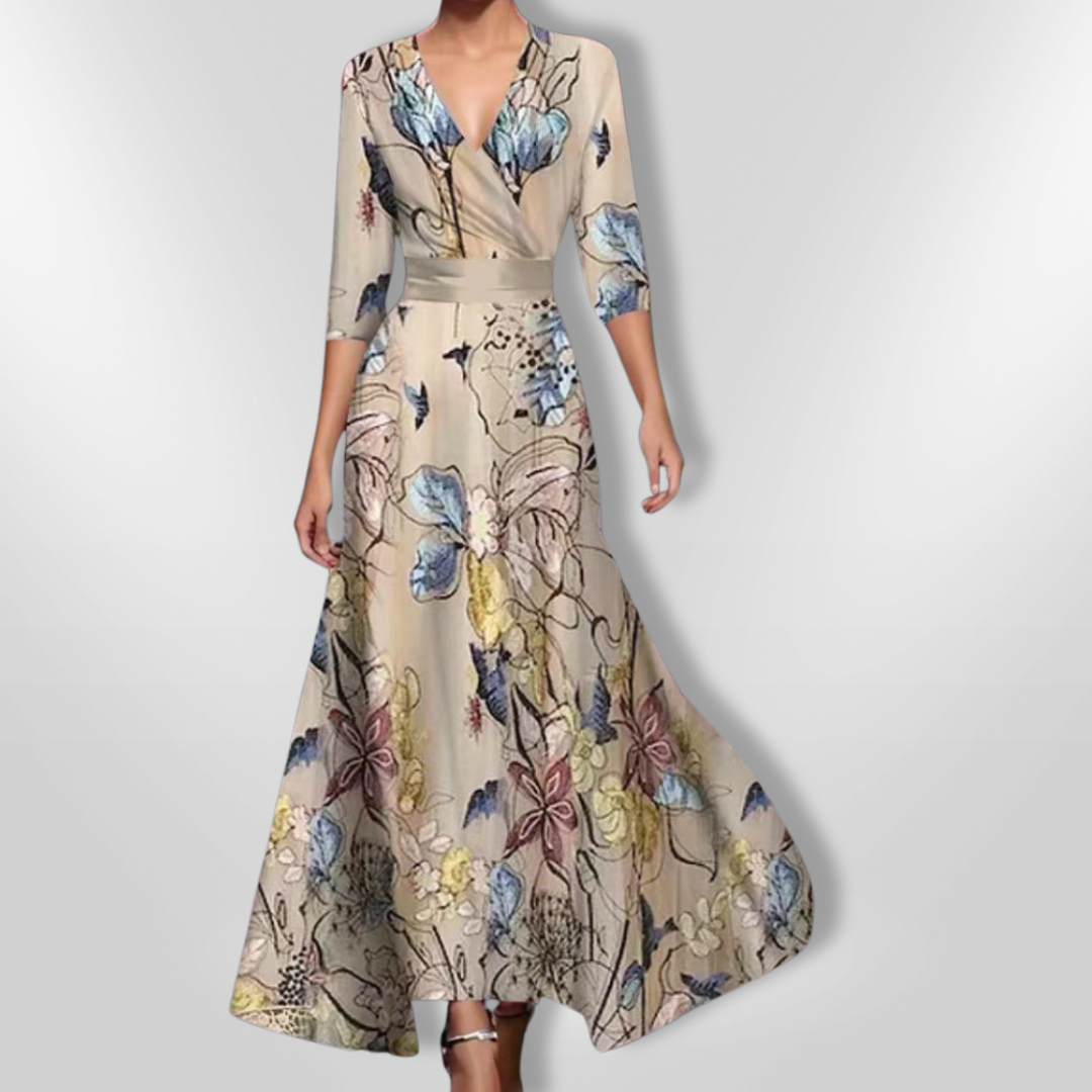 Elegant dameblomstret kjole i blødt stof, delikat blomsterdesign, fremhæver feminine former og passer til enhver lejlighed