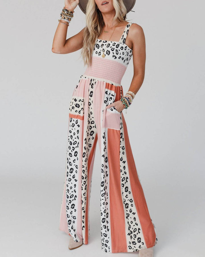 Elegant dame jumpsuit, vide ben, spaghetti stropper, orange, velegnet til hverdag og fest.