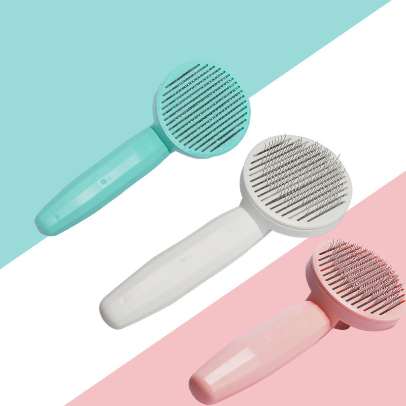 Ergonomisk kæledyrskost i hvid, pink og grøn, lavet af rustfrit stål og teknisk plast.