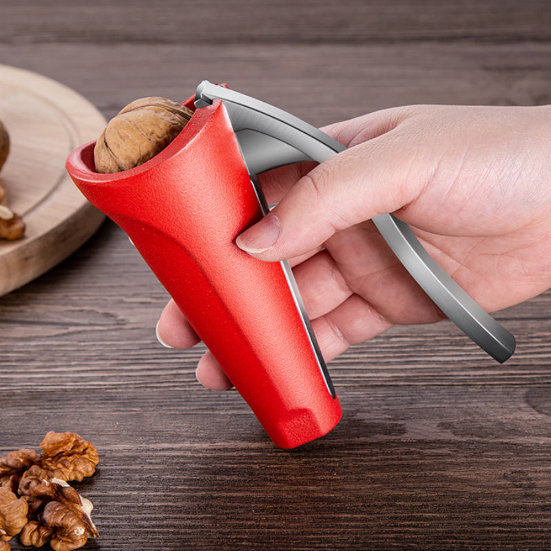 Ergonomisk svart/rød nøtteknekker i aluminiumlegering; buet håndtak og sagtannet kjeve, slitesterk og stilig.