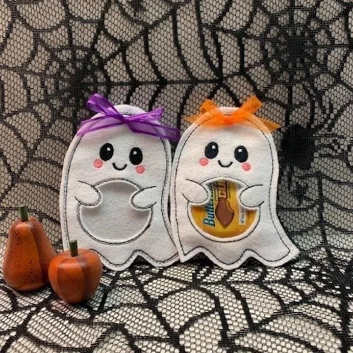 Halloween slikpose med græskar og spøgelse, gennemsigtig glimmerfilt, farverig og festlig.