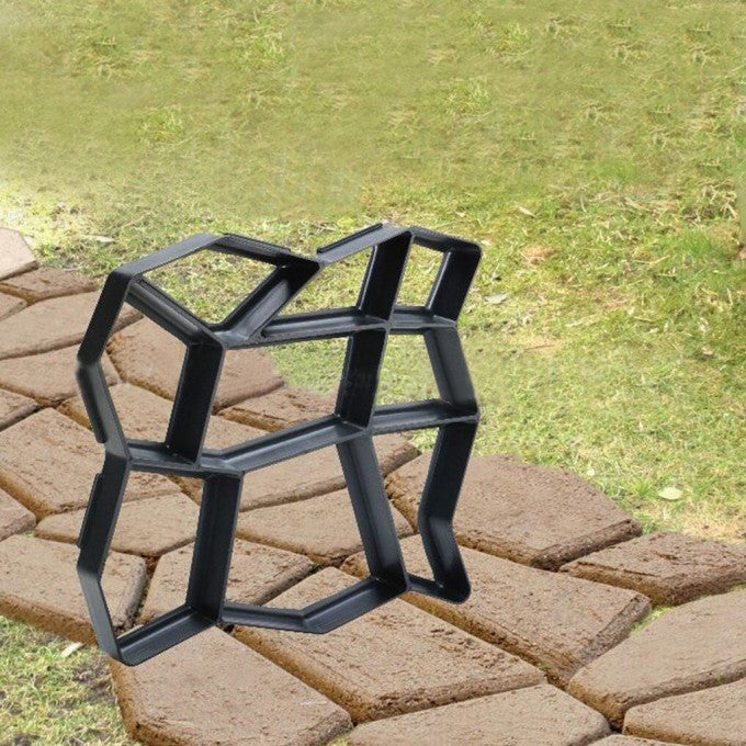 "Helppokäyttöinen puutarhapolun muotti, musta, 35x35 cm, täydellinen muotoilemaan polkuja puutarhaan tai patioille."