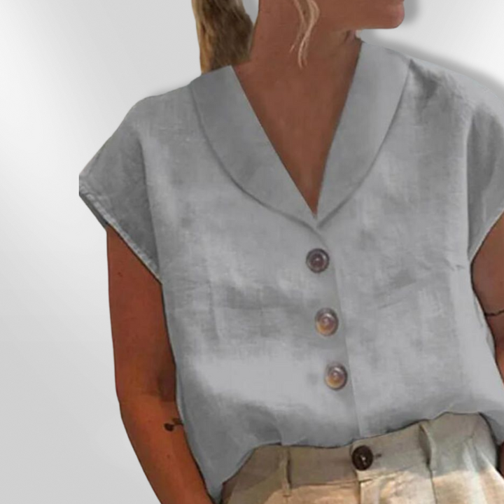 Dame bluse med bred krave, store dekorative knapper, blødt materiale, flere farver.