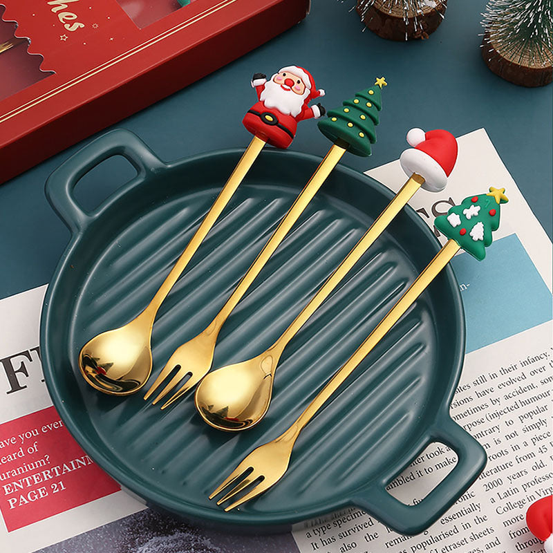 Julebestik sæt i rustfrit stål med dekorativ julemandfigur, guld og sølv farve, perfekt til fest