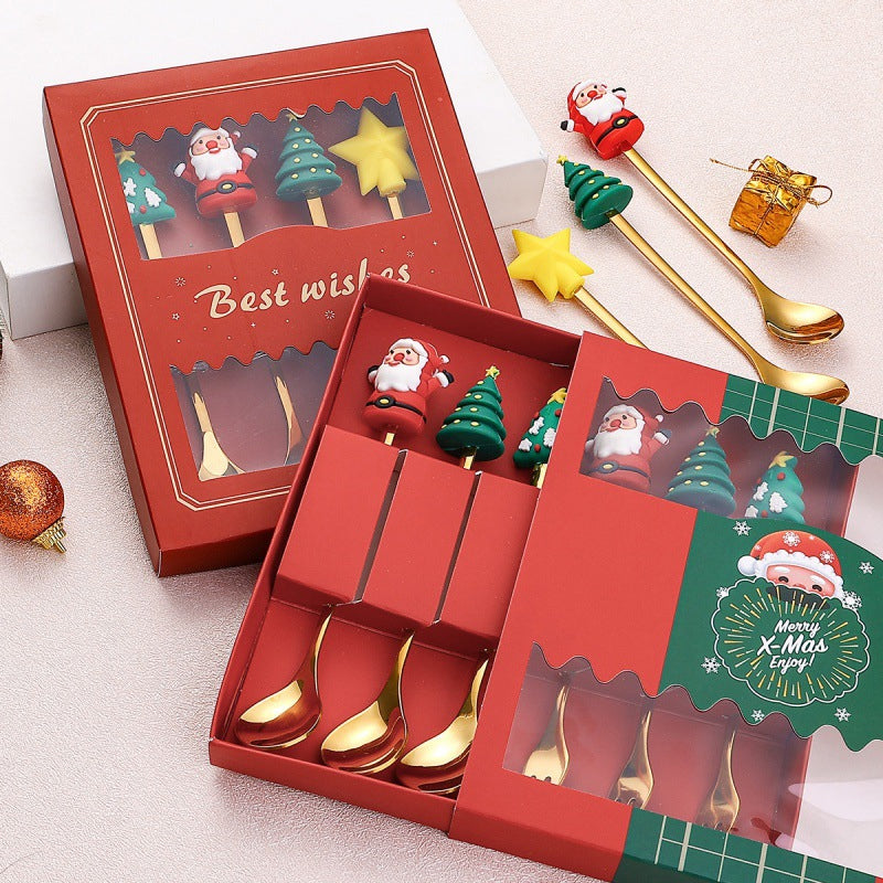 Julebestik sæt i rustfrit stål med dekorativ julemandfigur, guld og sølv farve, perfekt til fest