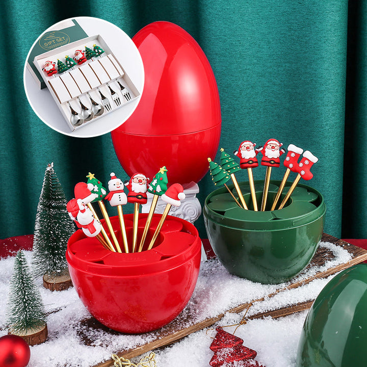 Julebestik sæt i rustfrit stål med dekorativ julemandfigur, guld og sølv farve, perfekt til fest