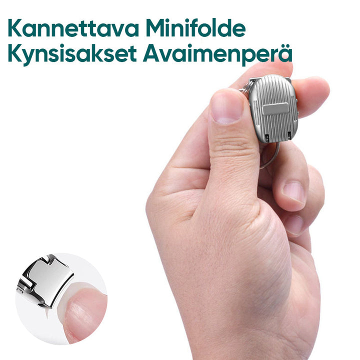 "Bærbar mini sammenklappelig negleklipper med nøgleringsstil, kompakt sølvfarvet design til rejser."