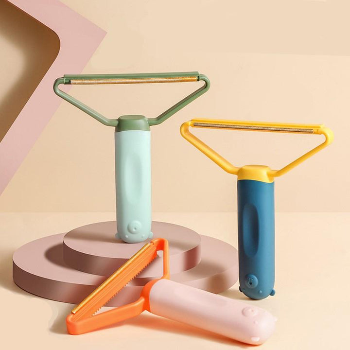 Let, flerfarvet dobbelsidet fnugfjerner, ergonomisk design, egnet til uld, bomuld og sarte materialer.