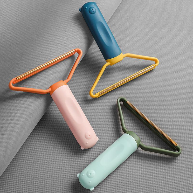 Let, flerfarvet dobbelsidet fnugfjerner, ergonomisk design, egnet til uld, bomuld og sarte materialer.