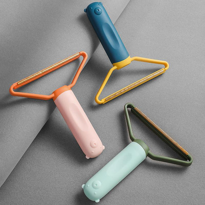 Let, flerfarvet dobbelsidet fnugfjerner, ergonomisk design, egnet til uld, bomuld og sarte materialer.