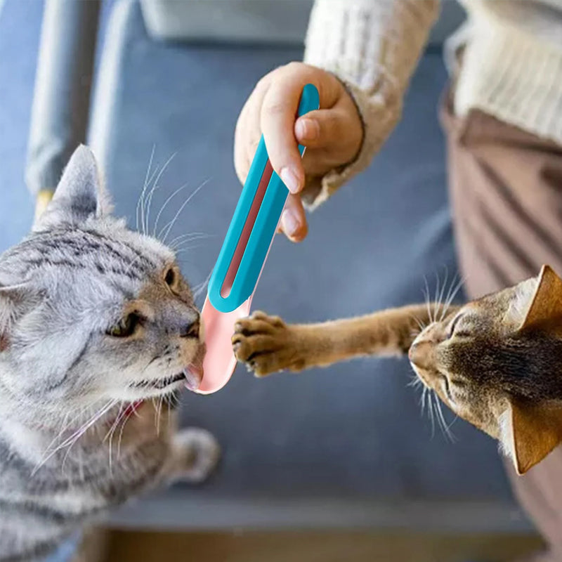 Katte vådfoder ske med tilknyttet pind; innovativ blå og lyserød enhed, der gør fodring ren.