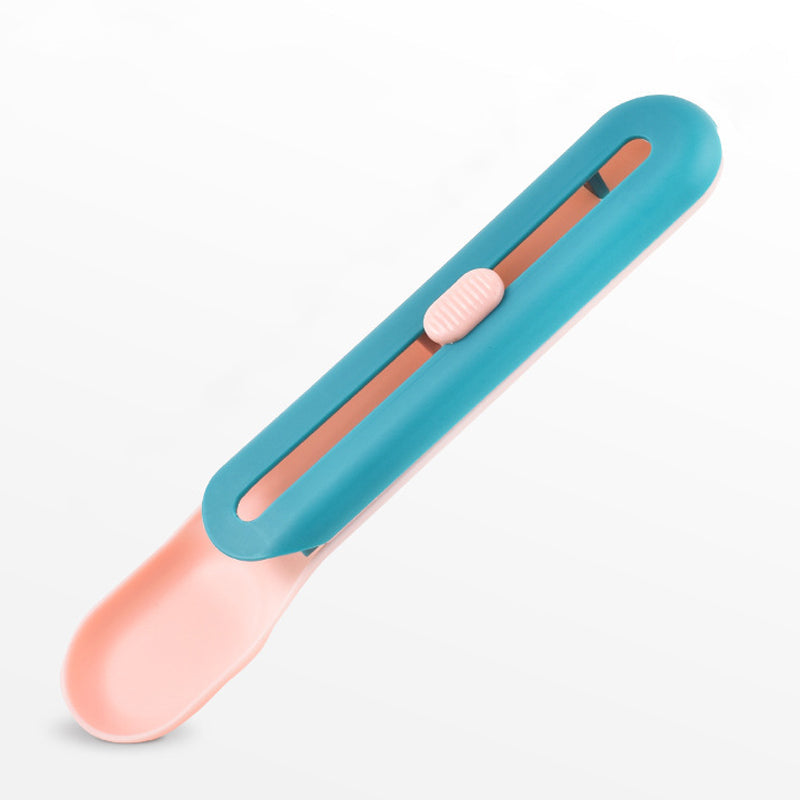Katte vådfoder ske med tilknyttet pind; innovativ blå og lyserød enhed, der gør fodring ren.