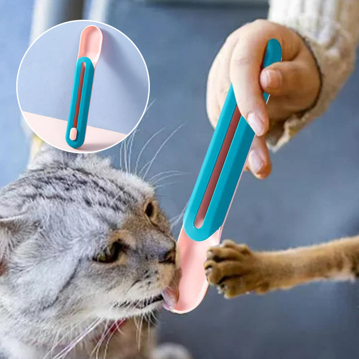 Katte vådfoder ske med tilknyttet pind; innovativ blå og lyserød enhed, der gør fodring ren.