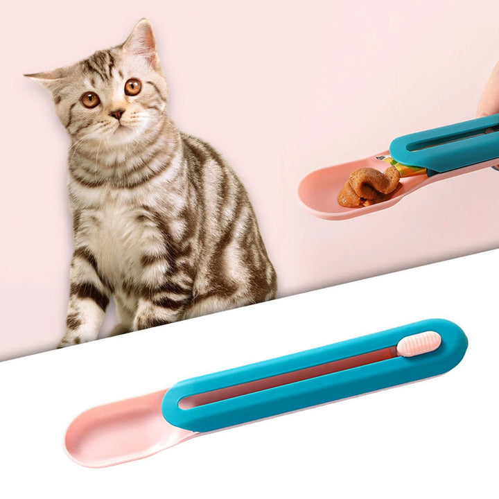 Katte vådfoder ske med tilknyttet pind; innovativ blå og lyserød enhed, der gør fodring ren.
