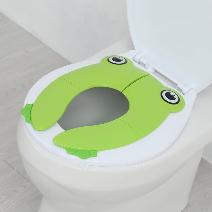 Sammenklappelig børne-toiletstol, grøn/blå/pink, praktisk og skridsikker, nem at opbevare.