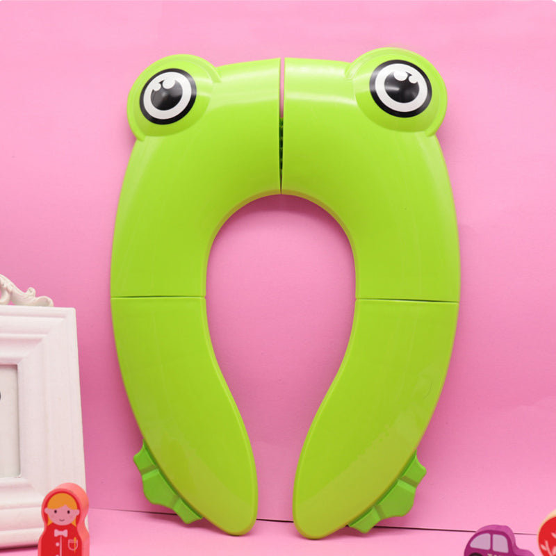 Sammenklappelig børne-toiletstol, grøn/blå/pink, praktisk og skridsikker, nem at opbevare.