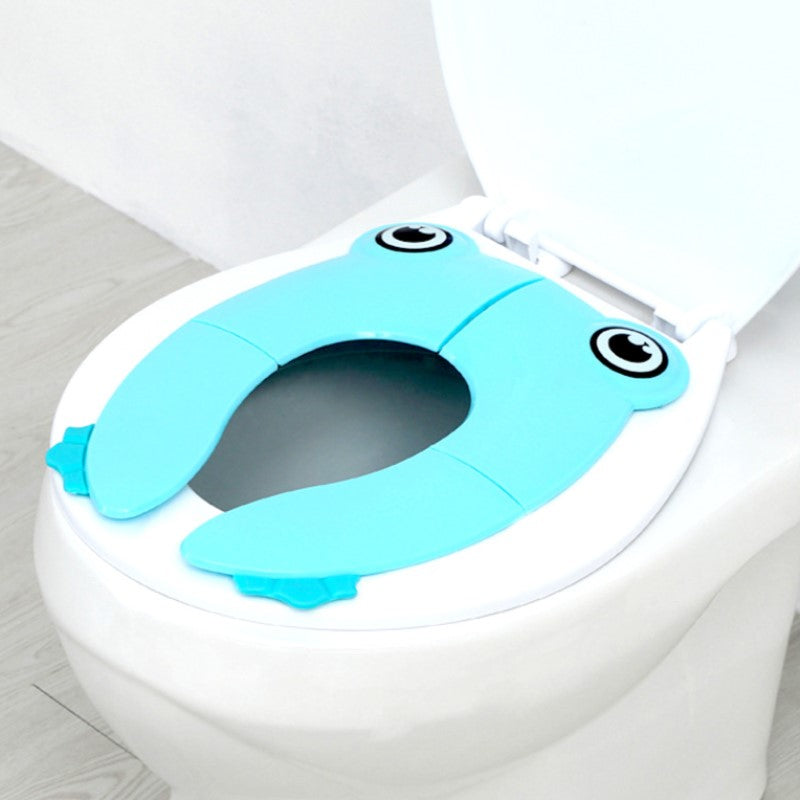 Sammenklappelig børne-toiletstol, grøn/blå/pink, praktisk og skridsikker, nem at opbevare.