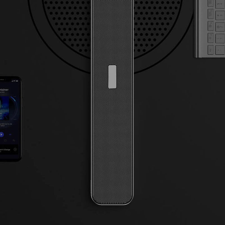Kompakt grå bærbar Bluetooth 5.0 højttaler til moderne smart home, tilbyder HD-lyd og 10-12 timers batterilevetid.