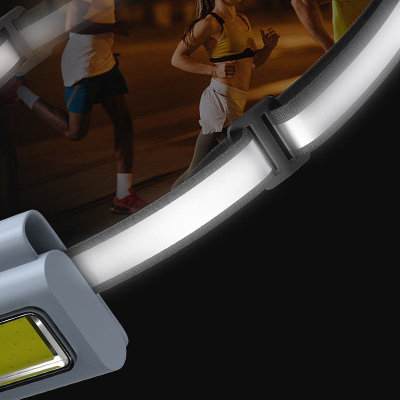 Kompakt grå bærbar LED-lommelygte, magnetisk beslag, flere lysindstillinger, USB-genopladelig, IPX4 vandtæt.
