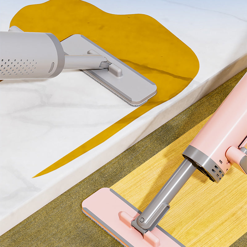 Kompakt selvpressende minimop i pink: let og praktisk til hjemmet og rejser.
