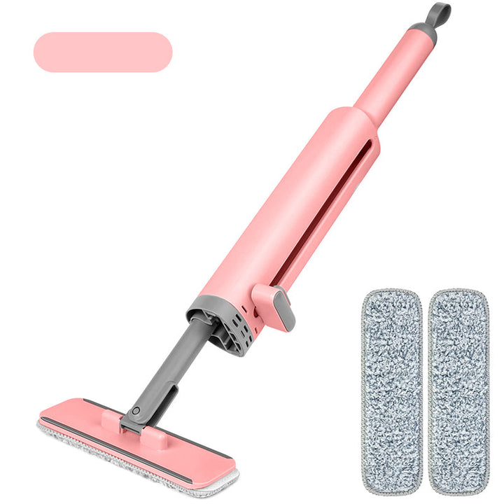 Kompakt selvpressende minimop i pink: let og praktisk til hjemmet og rejser.