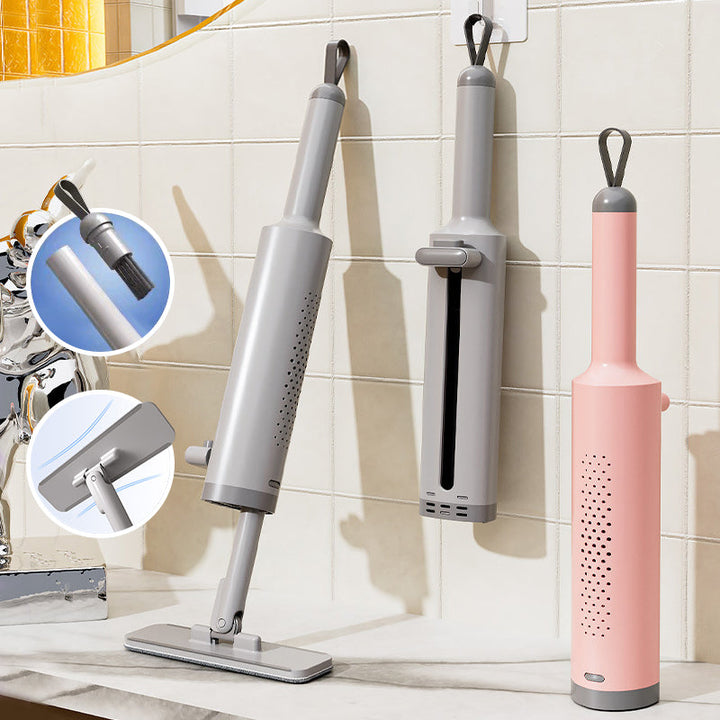 Kompakt selvpressende minimop i pink: let og praktisk til hjemmet og rejser.