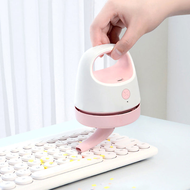Kompakt bærbar mini støvsuger, tilgængelig i grå, blå, pink og grøn, let og effektiv.