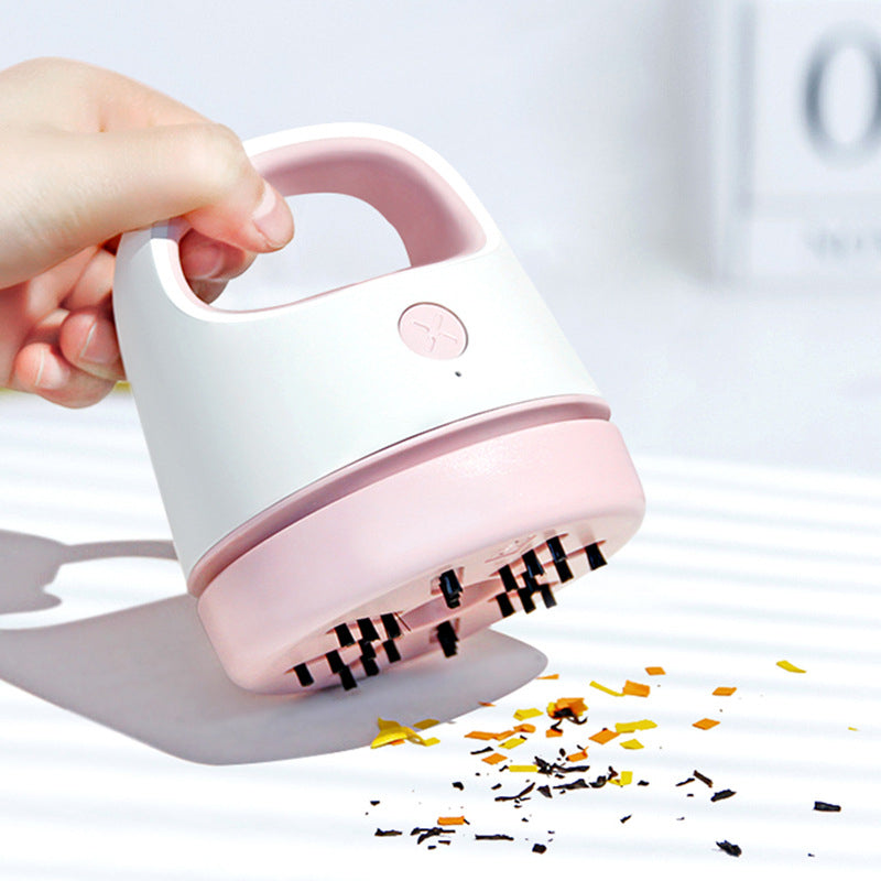 Kompakt bærbar mini støvsuger, tilgængelig i grå, blå, pink og grøn, let og effektiv.