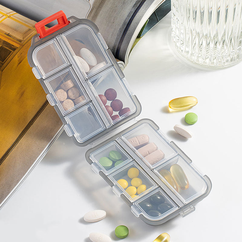 Kompakt bærbar pilleæske, 10 rum, multifarvede etiketter, plastik, gør det nemt at organisere medicin.