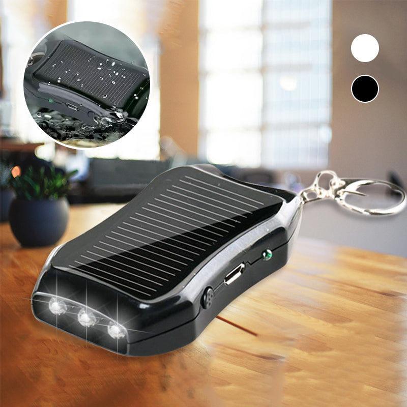 Kompakt hvid og sort mini powerbank nøglering, stilfuldt telefontilbehør, lommevenlig kraftfuld oplader.