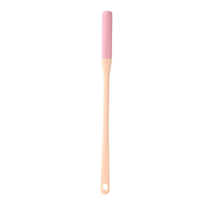 Kompakt tåspalte rensebørste, ergonomisk håndtag, bløde børster, ideel til fodhygiejne.