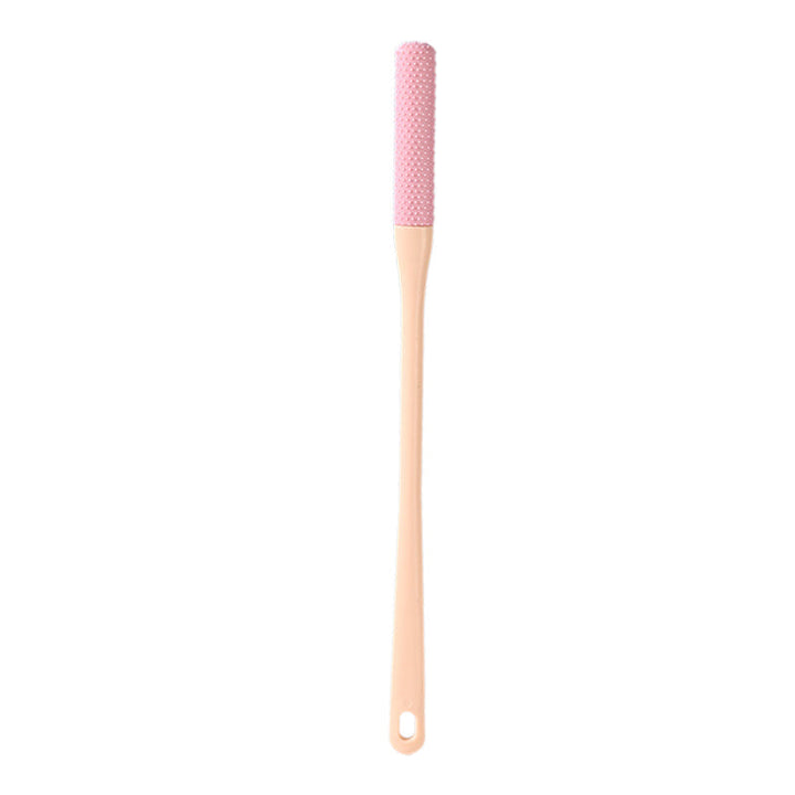 Kompakt tåspalte rensebørste, ergonomisk håndtag, bløde børster, ideel til fodhygiejne.
