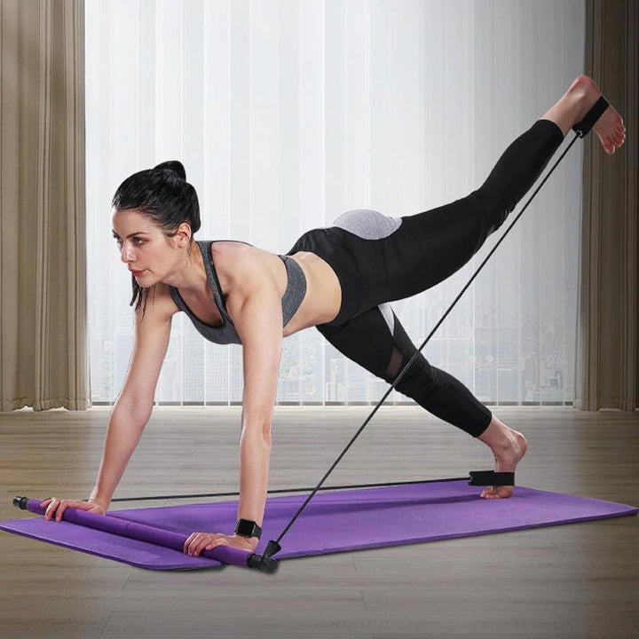 Kompakt violet bærbart Pilates-stangssæt med modstandsbånd, ideelt til alsidig kropstræning og nem transport.