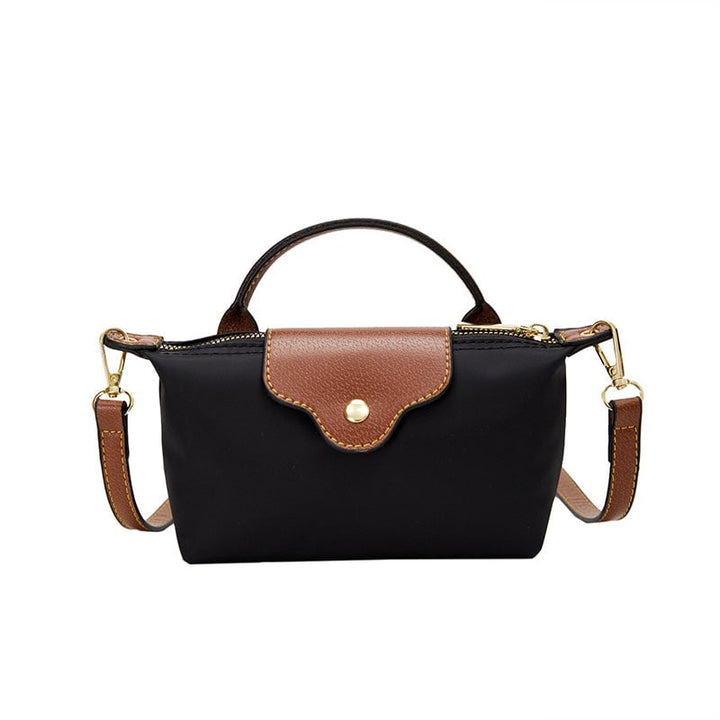 Kompakt farveblok crossbody-taske til damer i nuancer af blå, sort og khaki; en praktisk og stilfuld accessory.