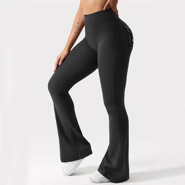 Højtaljede dame yogaleggings, sorte, med sidelommer, åndbart stof til træning og afslapning.