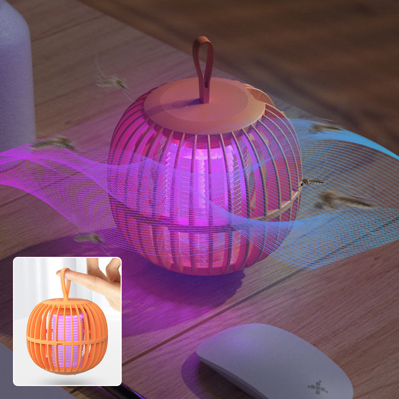 "Kurpitsan muotoinen äänetön 2 in 1 hyönteisloukkuvalo violeteilla LED-valoilla ja USB-latauksella."