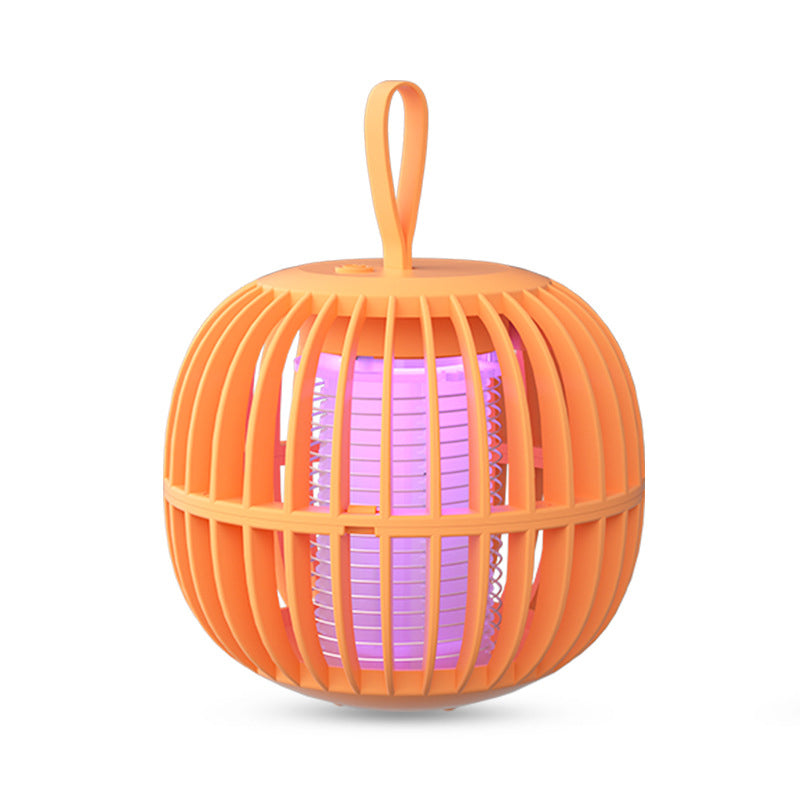 "Kurpitsan muotoinen äänetön 2 in 1 hyönteisloukkuvalo violeteilla LED-valoilla ja USB-latauksella."